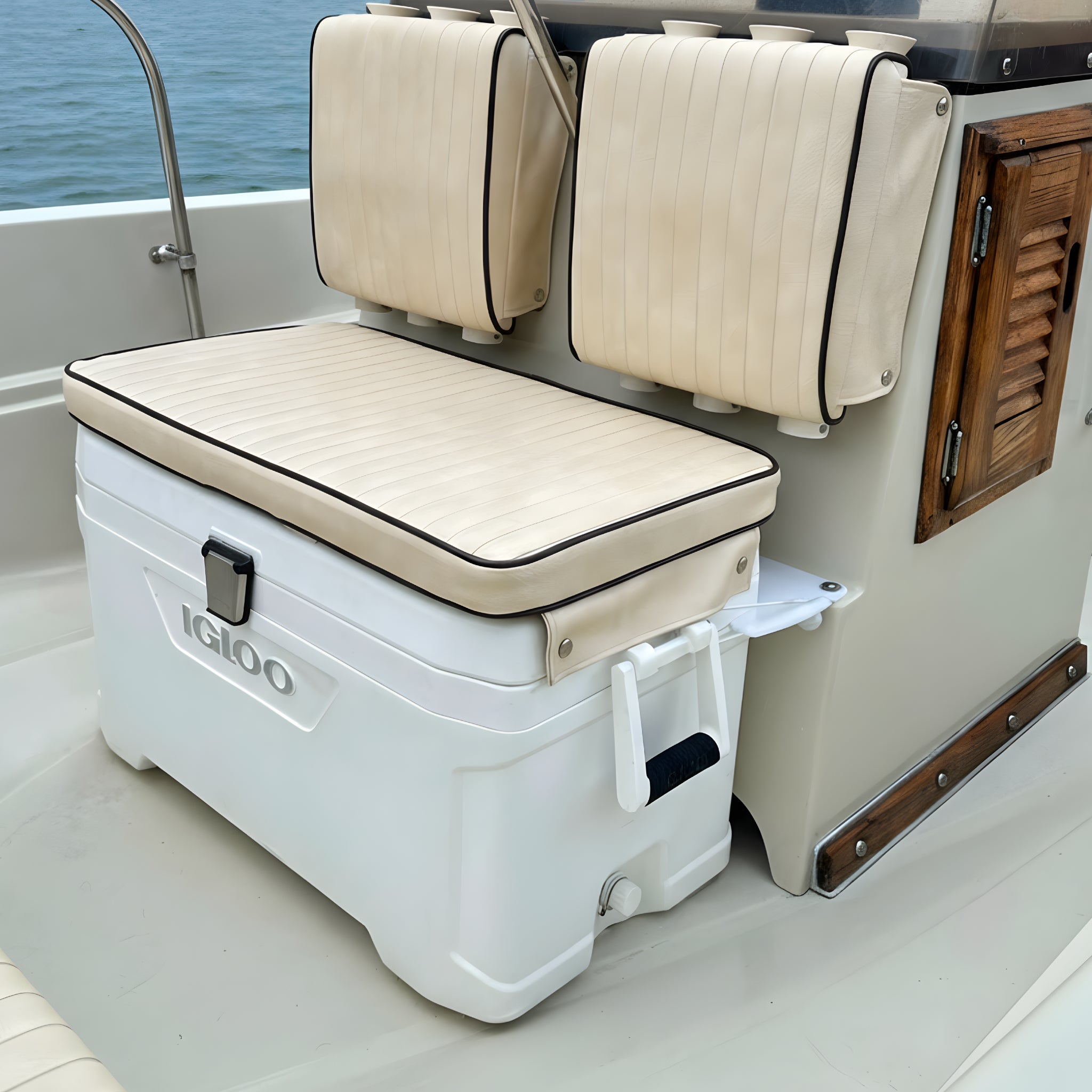 White Igloo cooler with beige cushion on a boston whaler montauk